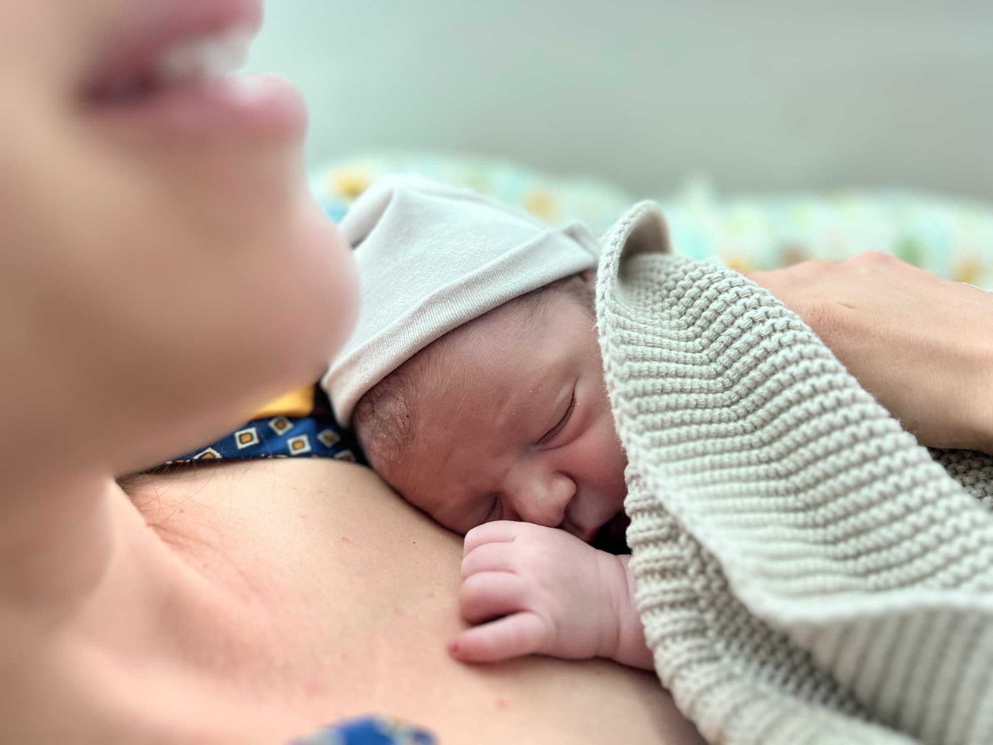 Newborn resting peacefully on mother's chest